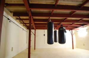 A picture of some punching bags hanging from the steel structure in Eastgate Boxing Club that AJN supplied steel for