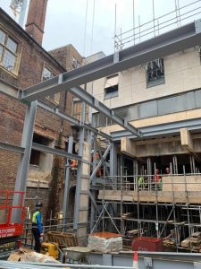 A view of the St Catharine’s College steel structure which will eventually be a dining hall with people working to construct it
