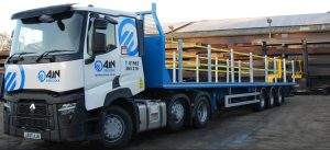 A full image of a Renault AJN rigid lorry complete with trailer and all safety features